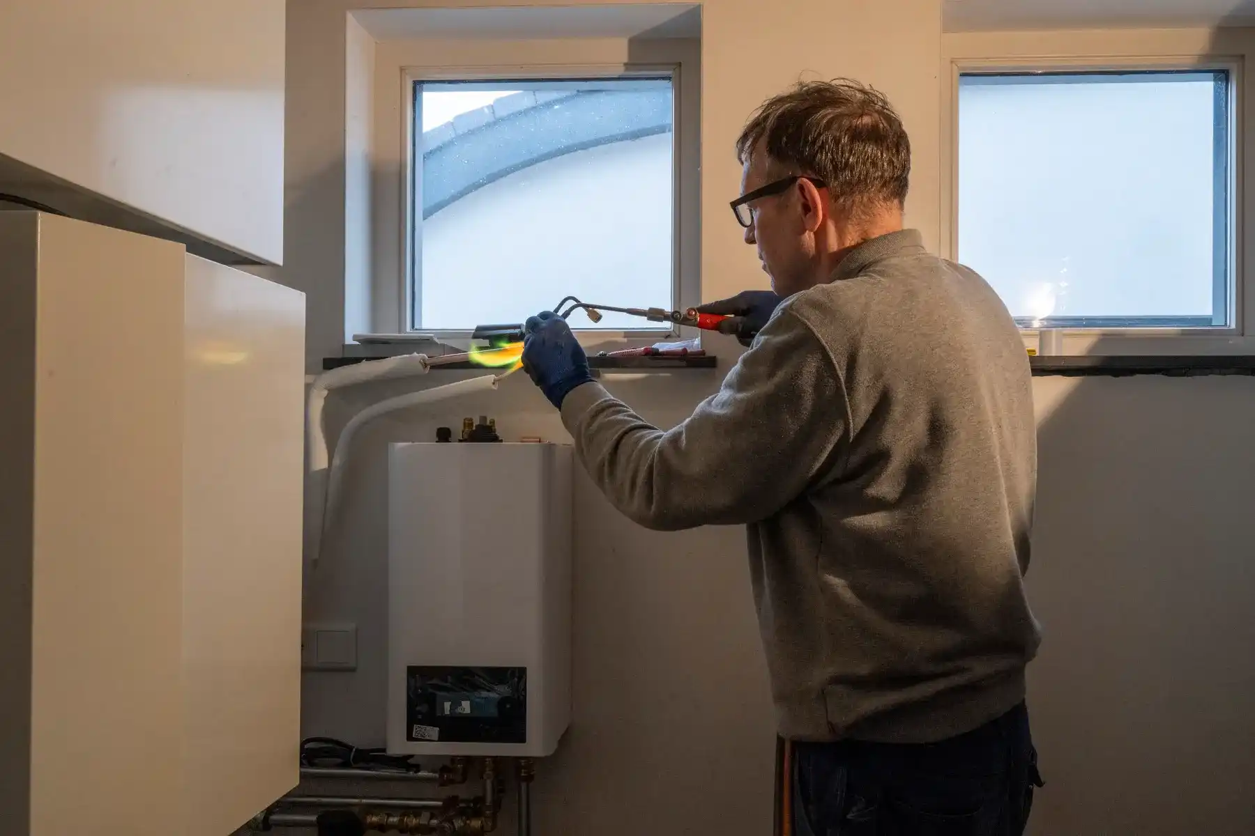 Gas Safe engineer diagnosing a boiler fault